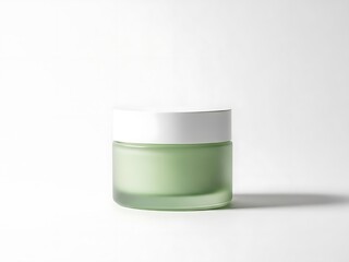 A small green cosmetic jar with a white lid on a plain surface viewed from the front.