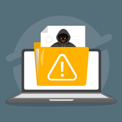 Hooded hacker threatens a laptop with a caution folder icon. © AlHanif