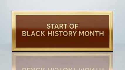 Elegant bronze plaque announcing the official start of black history month featuring raised golden lettering on a reflective surface perfect for cultural promotion and heritage recognition campaigns.