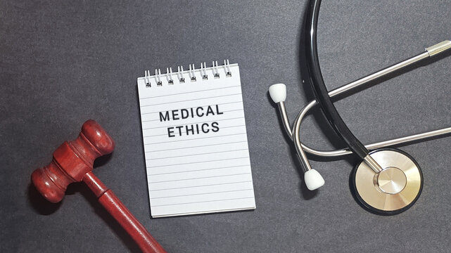 Understanding Medical Ethics Symbolic Representation of Healthcare Law, Justice, and Professional Principles with Stethoscope, Gavel, and Notepad