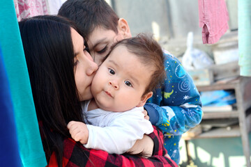 Three latin siblings with big age difference.
