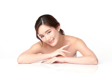 Fototapeta premium A beautiful young Asian woman with clean, fresh skin against a white background. Skincare, facial treatment, cosmetology, beauty, and spa. An elegant portrait of an Asian woman.