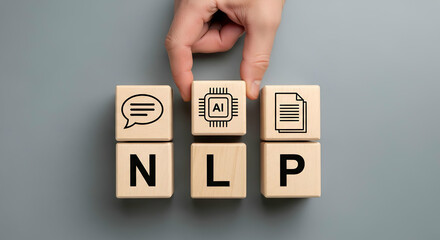 Hand placing wooden block with ai chip icon on top of nlp blocks representing natural language processing concept