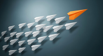 Orange paper airplane leading a group of white paper airplanes in formation