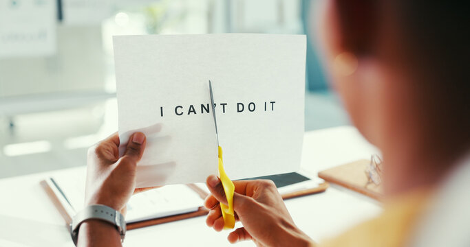 Hands, cutting and word for motivation, office and scissors to remove negative letters and document. Editing, message and person with tool for I can transformation, change and positive affirmation