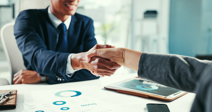 Business people, meeting and handshake with agreement in office for partnership or deal. Businessman, employees or colleagues shaking hands with documents for onboarding recruitment or job hiring