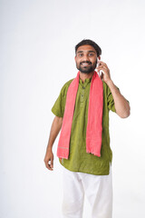 young indian farmer talking on smartphone standing on white background