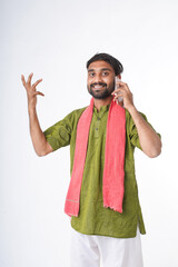 young indian farmer holding smartphone standing on white background