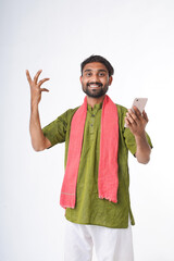 young indian farmer holding smartphone standing on white background