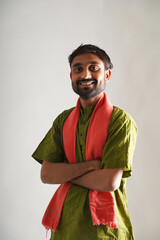 happy young indian farmer standing on white background