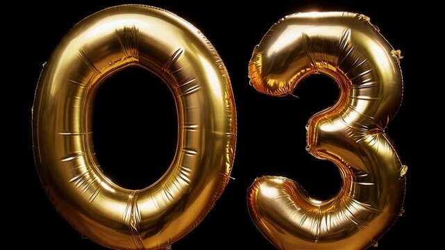 number 03 gold balloons on a black background