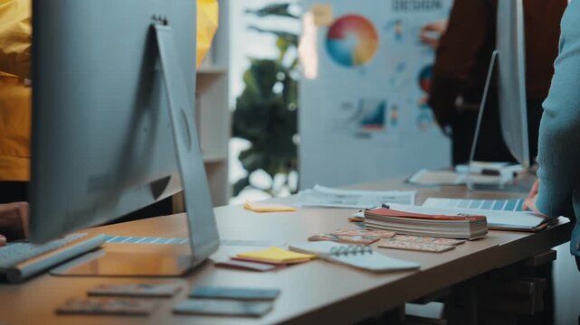 A vibrant office setting where business professionals collaborate on innovative ideas during a brainstorming session, surrounded by charts and practical tools. SACTR