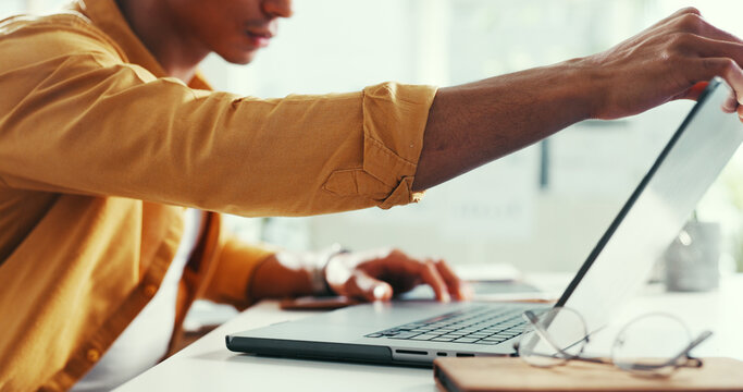 Laptop, hands and businessman in office with research for creative project with email for feedback. Technology, reading and male magazine editor with computer for article with publishing in workplace