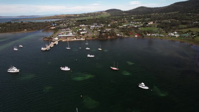 Yachts And Sailboats Anchored In Blackman Bay In Sorell, Tasmania, Australia. - aerial shot