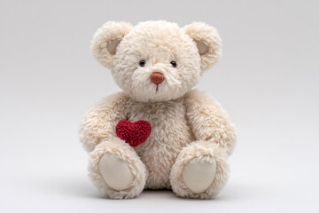Obraz premium Adorable teddy bear holding a red heart, perfect for expressing love, romance, and Valentine's Day greetings with warmth and affection