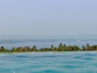 Luxury resort atmosphere with swimming pool near Vagator Beach in Goa, India

