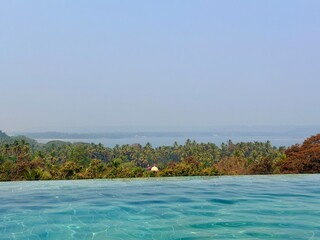 Luxury resort atmosphere with swimming pool near Vagator Beach in Goa, India
