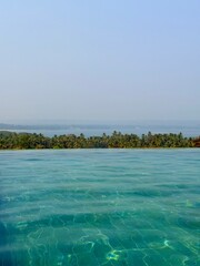 Luxury resort atmosphere with swimming pool near Vagator Beach in Goa, India
