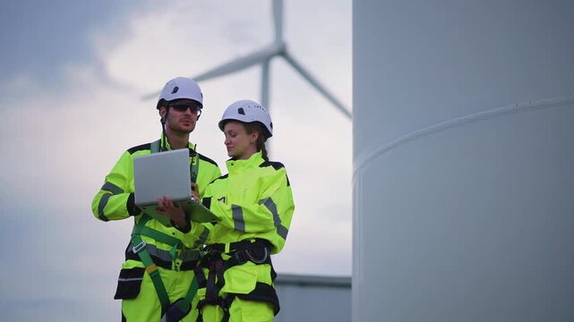 Engineers working on site in wind turbine farm, Wind turbines generate clean energy source, Eco technology for electric, industry environment, sustainable technology wind power maintenance.