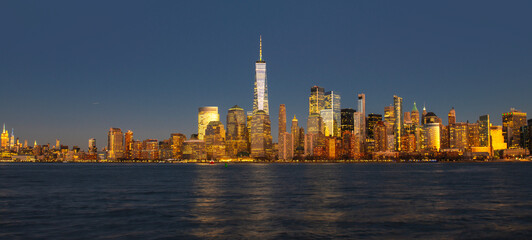 Obraz premium NYC with Manhattan at night. New York cityscape in Manhattan. New York skyline downtown. New York iconic skyline. New York panorama city.