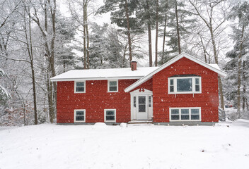 red winter house in snow
