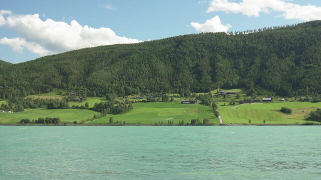 Vagavatnet Lake With Blue Water In Rural Landscape Of Lom In Norway. wide static shot