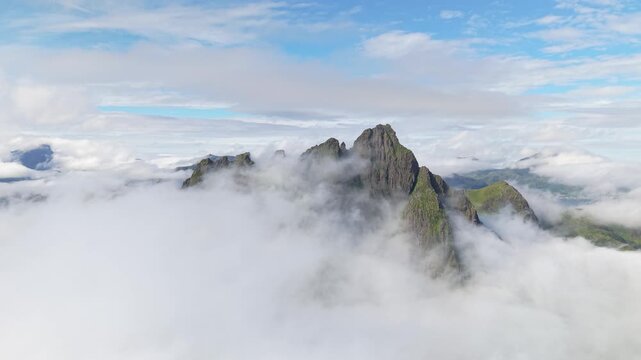 Clouds Engulfing Nonstinden Mountain Peak Near Ballstad In Vestvag&oslash;ya Island, Lofoten Islands, Norway. Aerial Shot
