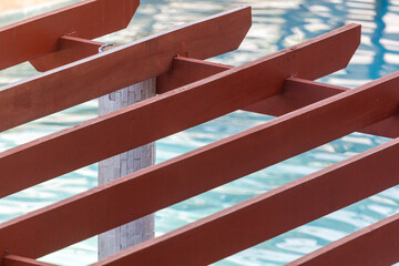 A wooden structure with a white pole in the middle
