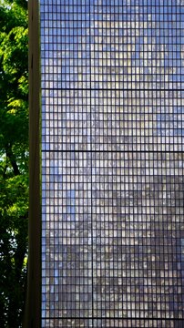 Closeup of dichroic tile cladding on a building in Japan