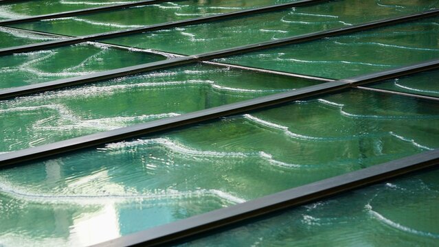 Glass skylight water feature in downtown Tokyo