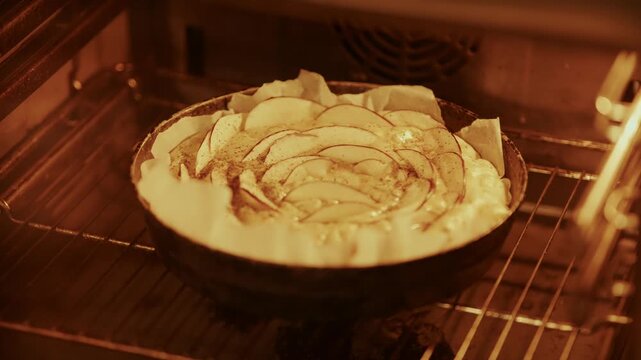 Homemade Apple Pie Baking in Oven. Fruit Tart. Sweet Dessert in Electric Stove