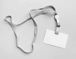 Blank white Id card with lanyard. Blank plastic badge and lanyard mockup. Space for text. Flat lay.