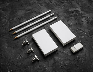 Blank stationery set on black textured surface. Corporate identity mockup. Responsive design template.