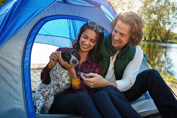 Happy, camping and couple with dog, vacation and bonding together with weekend break, relax or...