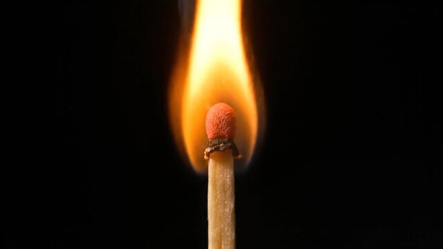 A burning matchstick ignites with artificial intelligence generated flame, depicting fire, match, flame, burning, heat