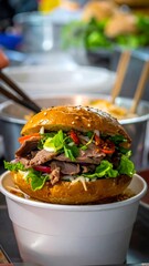 A mouthwatering burger in a white bowl