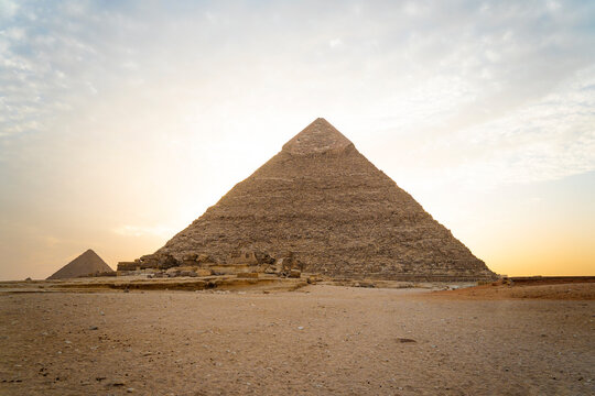 Archaeological complex of Great Egyptian Pyramids is located on the Giza plateau. second pyramid of Chephren khefren in the night light at sunset. sun sets behind the pyramid.