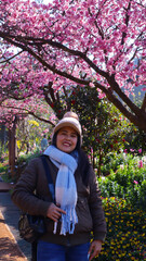 woman smile in Beautiful flowers blooming garden.colorful vintage