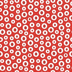 Seamless repeating pattern featuring hand drawn red Easter eggs with white polka dots inside circles. Playful fun background for Easter packaging, wrapping paper, textiles, wallpapers, greeting cards