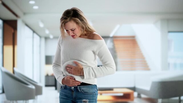 Young Sick Woman With Stomach Pain