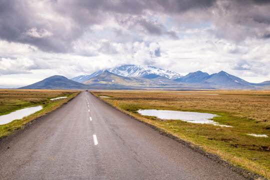Endless Route 910 road leading to Mount Snaefell across Icelandic tundra