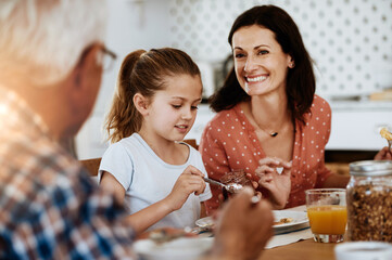 Happy, generations or family at table with breakfast, bonding together or connection in healthy...