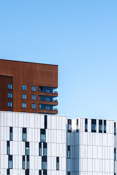 residential architecture building facade with modern windows and apartment units in urban liljeholmskajen stockholm suitable for real estate listings