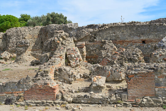 Sibari ancient city ruins revealing historical architecture. Sybaris archaeological site revealing ancient Roman and Greek structures under a clear sky.