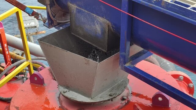 A screw conveyor (auger) used to transport drilling cuttings from solids control equipment  to a vertical cuttings dryer for fluid recovery and waste management
