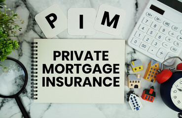 PMI Private Mortgage Insurance text written on notepad with house model, calculator, magnifying glass and alarm clock on marble background