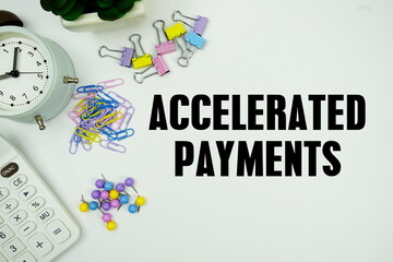 Accelerated Payments message with calculator, alarm clcok and Stationery on white background