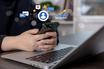 Digital marketing and social media engagement concept with smartphone and laptop. Online communication, customer interaction, brand trust, content strategy, and business growth in modern digital platf