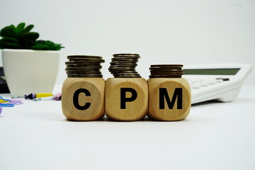 Stack of coins with wood blocks with 