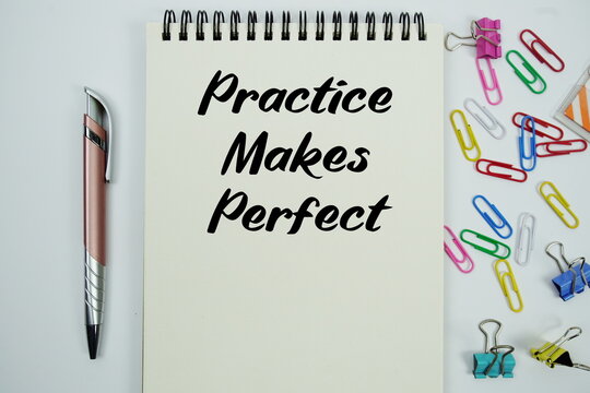 Practice Makes Perfect text message written on notepad with stationery flat lay on white background